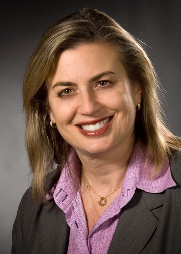 Jacqueline Moline, MD, wearing a purple shirt